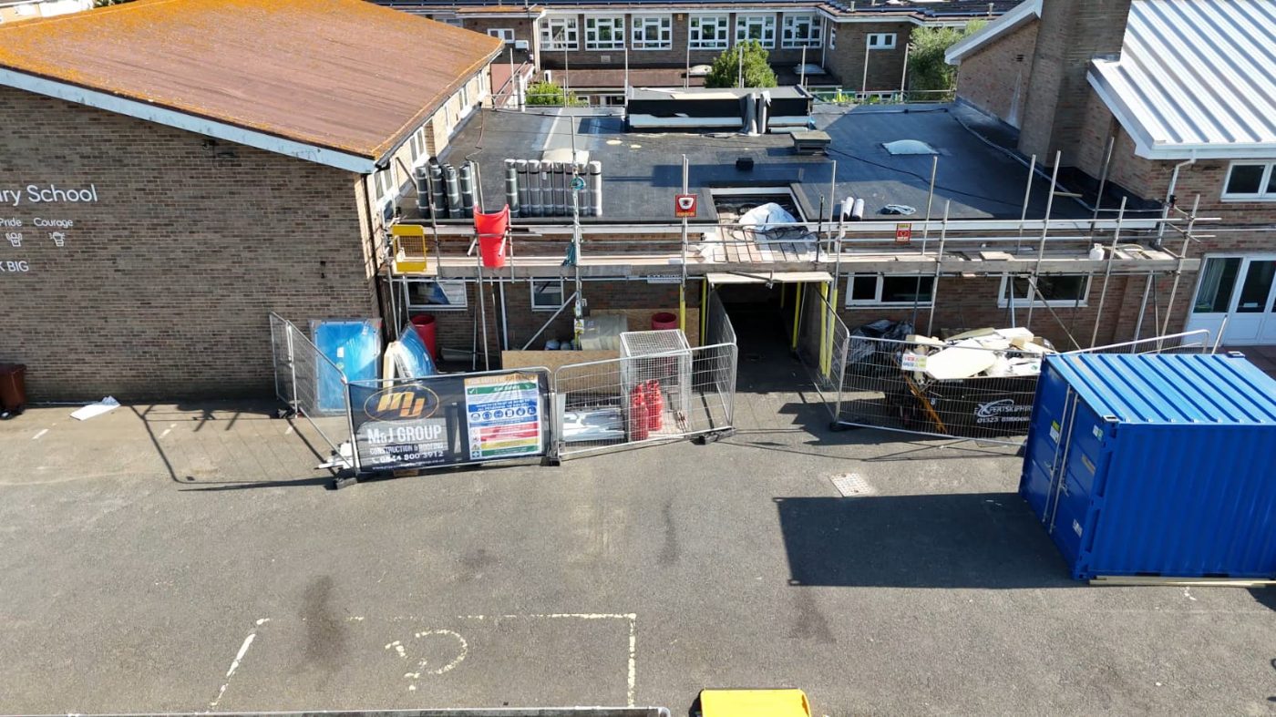 HTK access scaffold to a primary school for flat roof replacement, with Heras fencing and segregated site