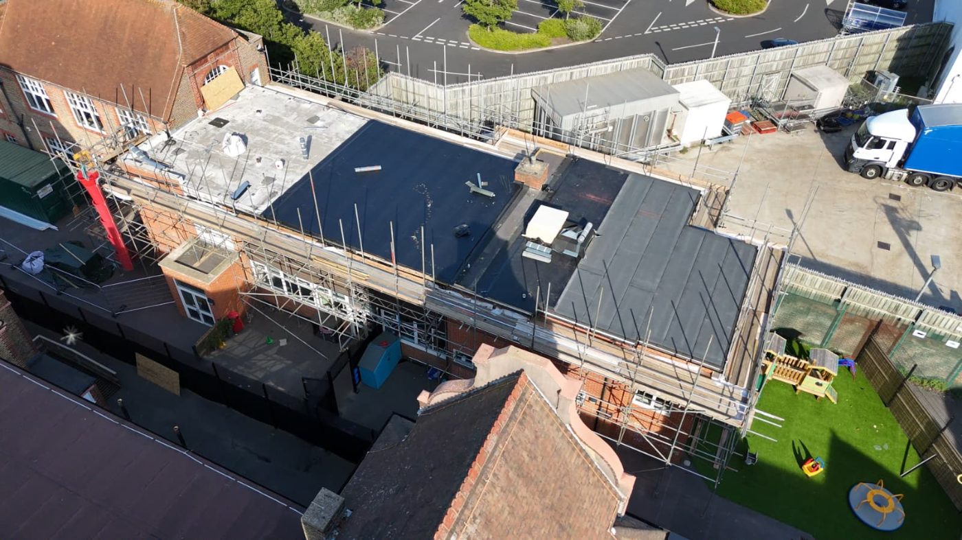 HTK full perimeter scaffold wrap to a primary school for roof replacement works, viewed from above