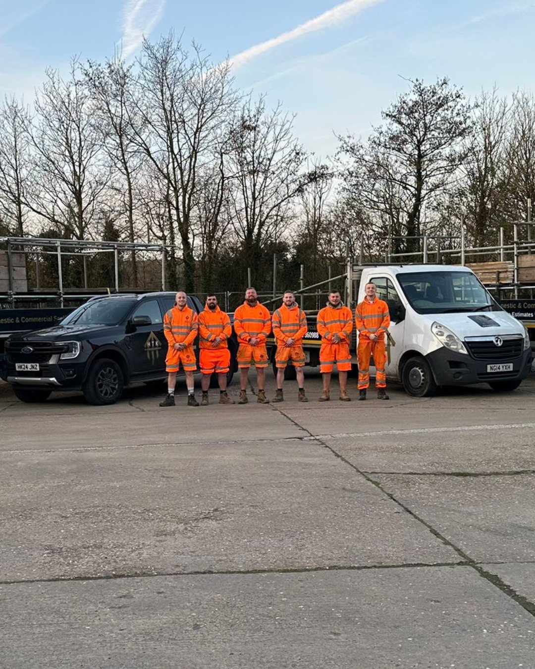 The HTK Scaffolding team with their vehicles